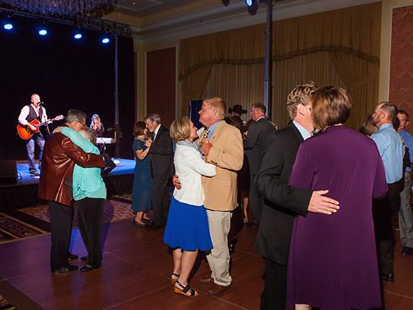 People dancing as Collin Raye performs